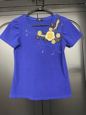 Royal Blue Short-Sleeve Tee with Yellow Floral Appliqué runs small